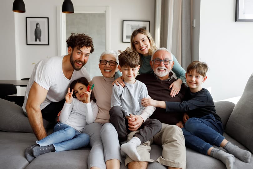 Multigenerational family enjoying time together at home in 2025
