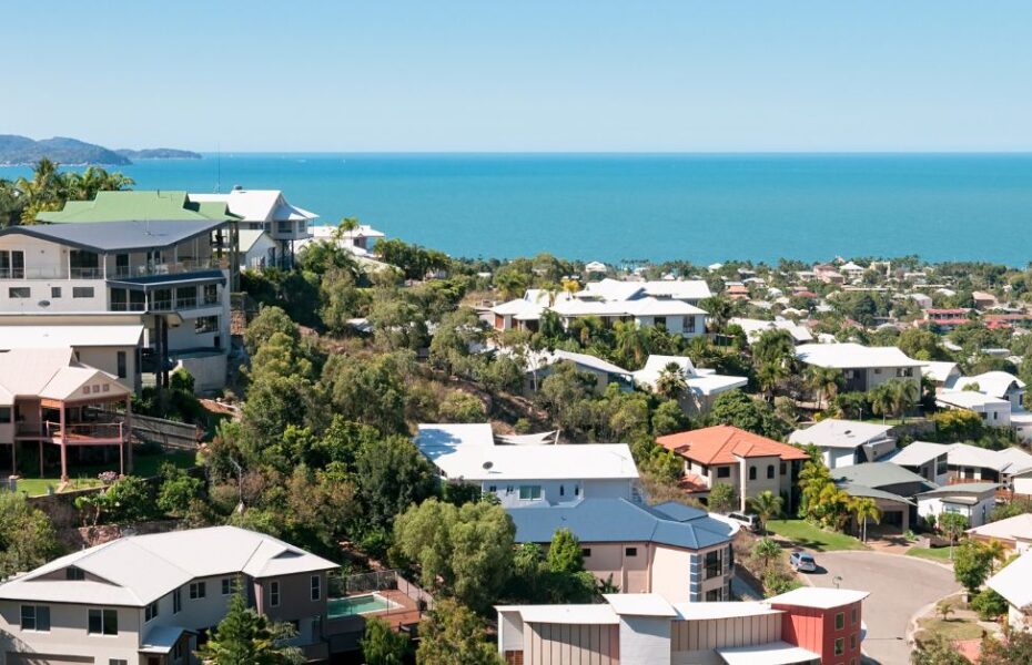 Urban coastal neighborhood with modern homes and ocean view, representing factors considered in urban property appraisals