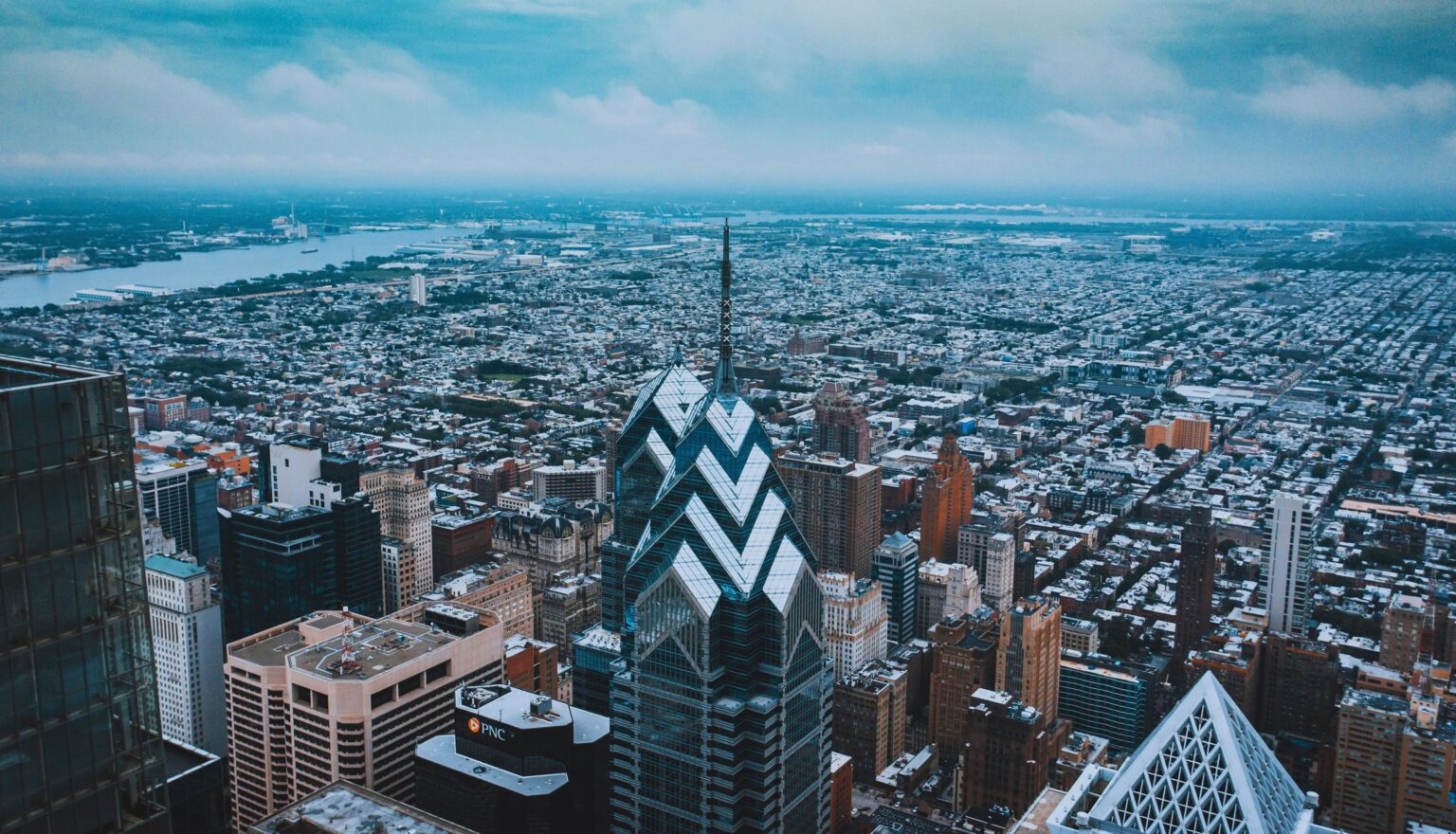 Dramatic low-angle view of a Philadelphia high-rise commercial building reaching into the sky.