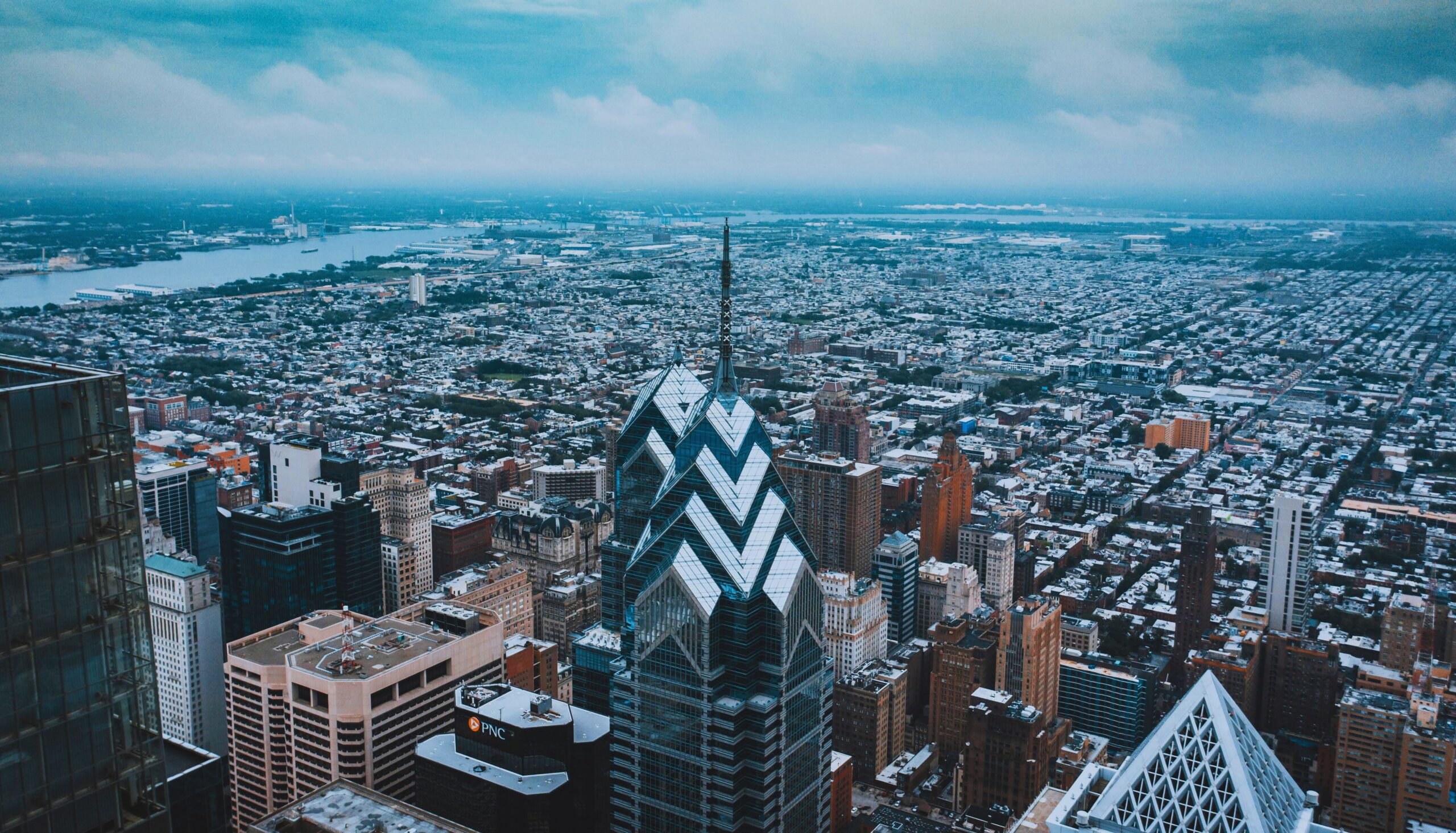 Dramatic low-angle view of a Philadelphia high-rise commercial building reaching into the sky.