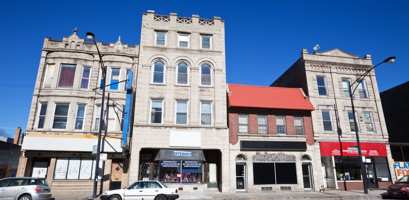 Chicago mixed-use three-flat with commercial space showcasing residential and commercial market trends for November 2025.