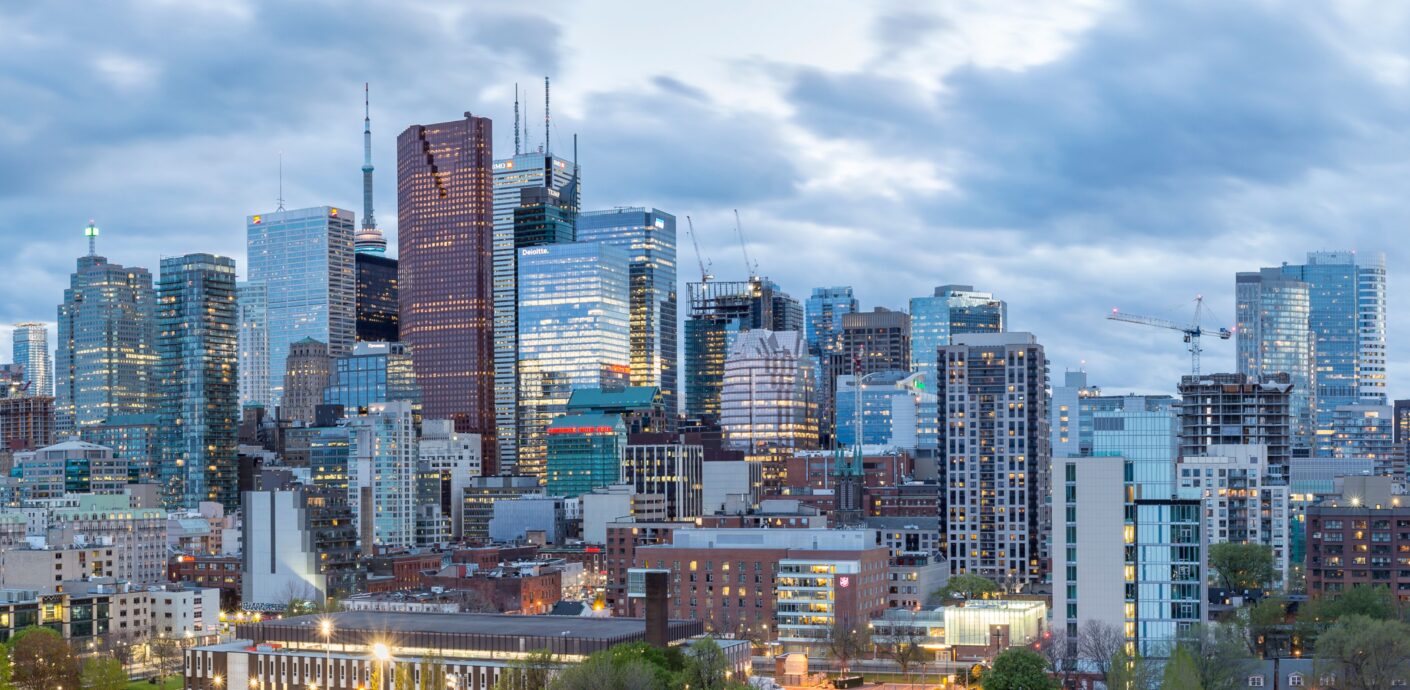 Cityscape Overview With Office Buildings And Residential Homes Background