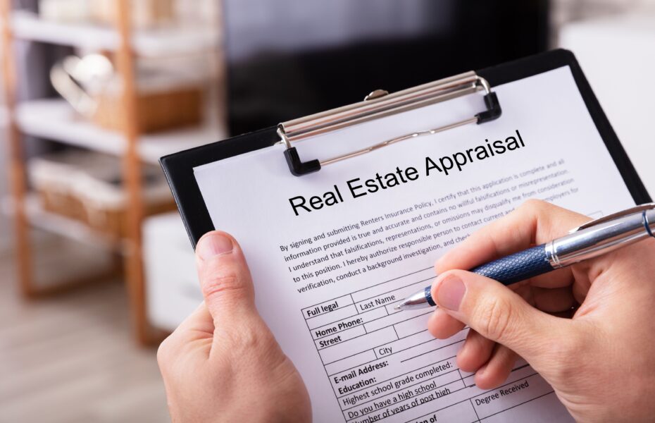 Bound commercial appraisal report open on a desk