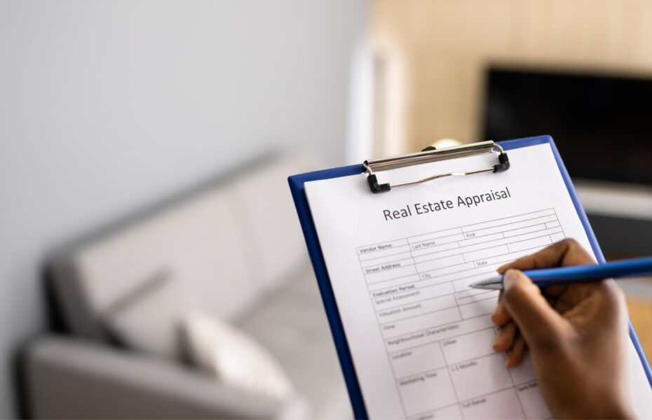 Appraiser filling up an appraial report of a Chicago brick home during a home appraisal